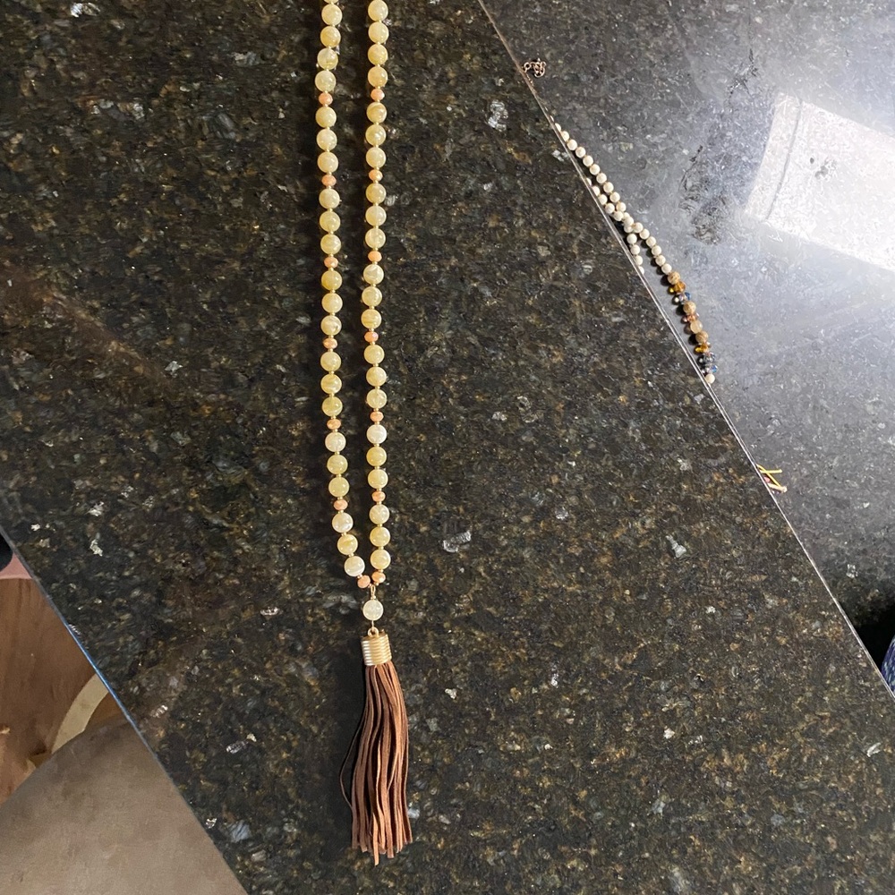 Beautiful long beaded necklace with tassel.